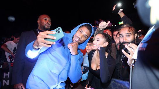 Former unified champion Anthony Joshua stops to take a photo with a fan before a media workout Wednesday in London. Former unified champion Anthony Joshua stops to take a photo with a fan before a media workout Wednesday in London.