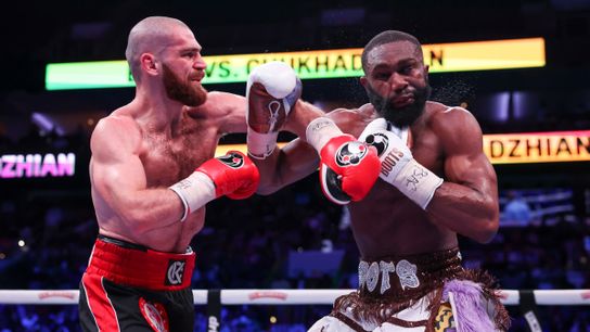 Karen Chukhadzhian (L) follows through after landing a left on Jaron Ennis Saturday in their IBF welterweight title bout. Karen Chukhadzhian (L) follows through after landing a left on Jaron Ennis Saturday in their IBF welterweight title bout.
