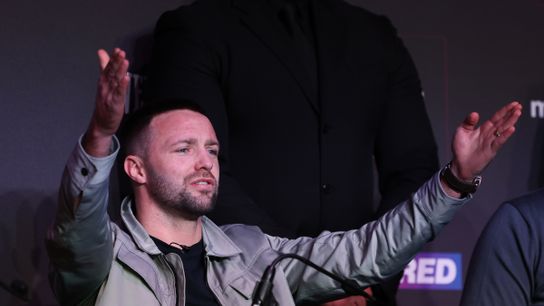Former undisputed super lightweight champion Josh Taylor gestures to the crowd in Manchester, England, during a press conference to announce his April 27 rematch with Jack Catterall. Former undisputed super lightweight champion Josh Taylor gestures to the crowd in Manchester, England, during a press conference to announce his April 27 rematch with Jack Catterall.